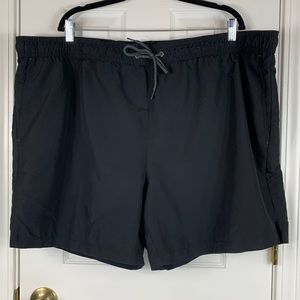 NWT George black swim trunks size 3XL(48-50). Above the knee, pockets